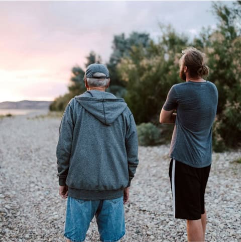 Two men walking on a beach