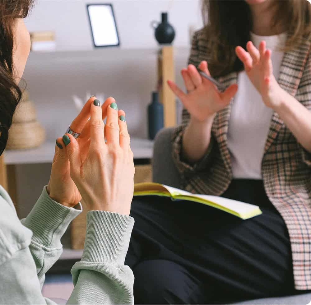 Two women talking during counselling